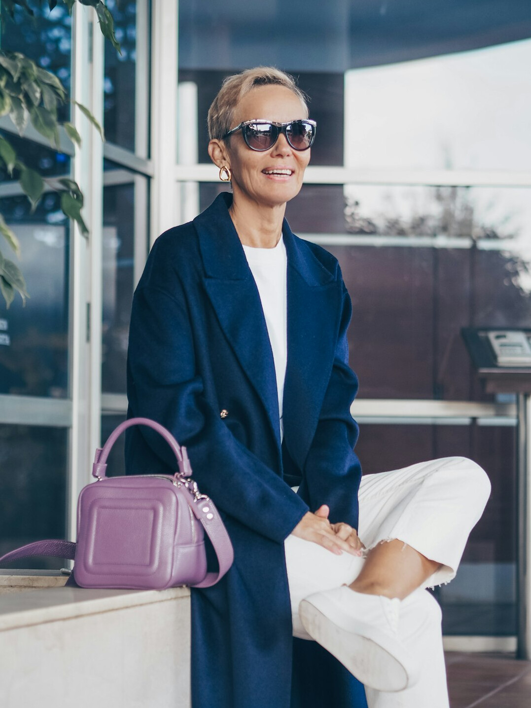 Portrait of a Croatian woman in a blazer smiling in an office